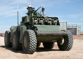 Illustration for article titled DARPA's Crusher Drives Itself, Laughs at Your Puny "Traffic"